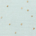 Muslin golden dots on green